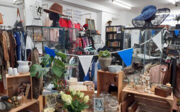 a display of homewares, glasssware, ornaments and flowers inside the Vision Foundation Portobello Road shop