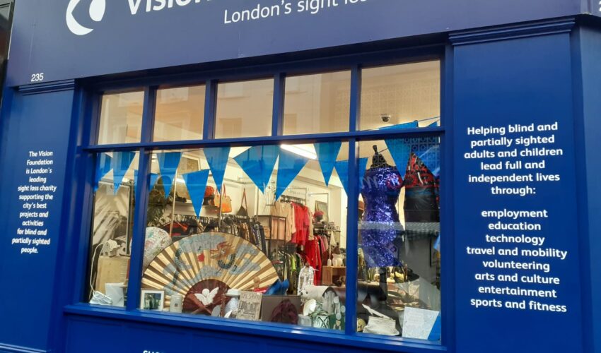 decorated shop window and text panels on outside of Portobello Road Vision Foundation shop