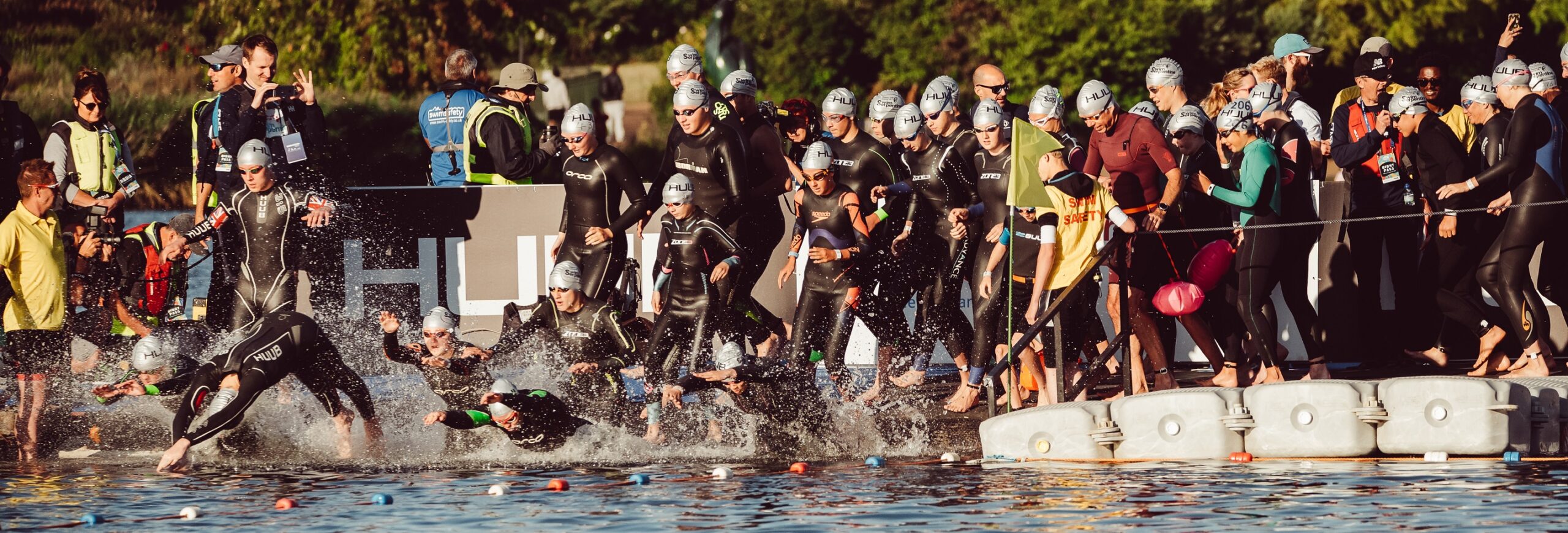 Swimmer jumping into the water at the start of the Swim Serpentine race