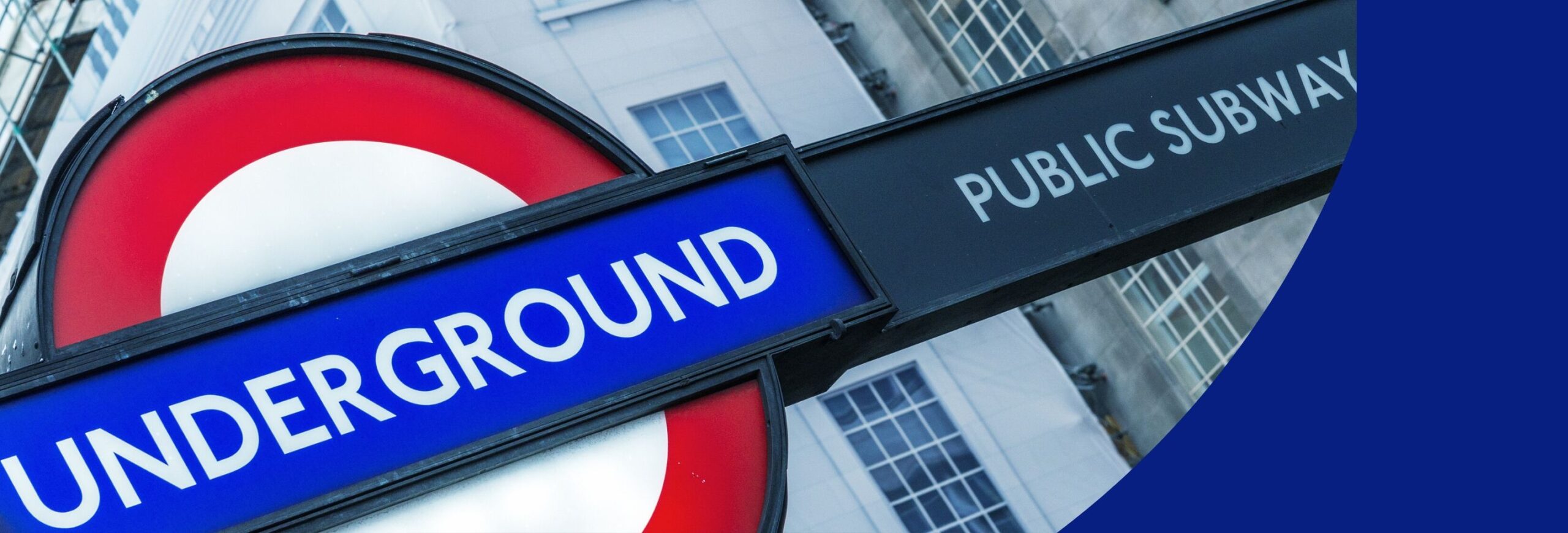 Image shows the red, white and blue London Underground sign.