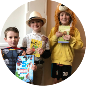 Seb, Archie and Milo dressed up for World Book day as a Aslan (Seb) Mr Gum (Archie) and Thor (Milo). They are holding their books up for the camera.