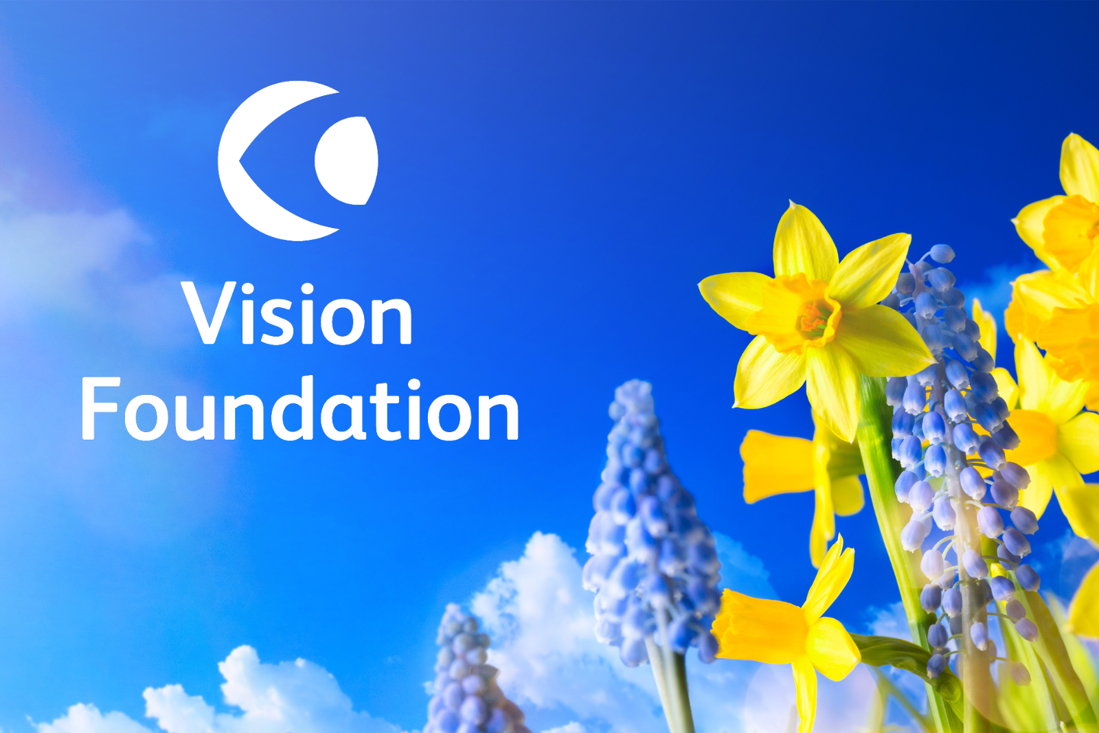 Daffodils and bluebells against a blue sky, with the VF logo in the sky.