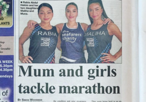 Rabia, Maliha and Muna stood arm-in-arm for a photo in the newspaper.