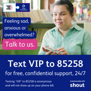 An Asian, visually impaired woman in her early 20s, wearing a green blouse. She is using her phone to text in a library. Text: “Feeling sad, anxious, or overwhelmed? Talk to us. Text VIP to 85258 for free, confidential support, 24/7. Texting 'VIP' to 85258 is anonymous and will not show up on your phone bill. Vision Foundation and Fight for Sight, in partnership with Shout".