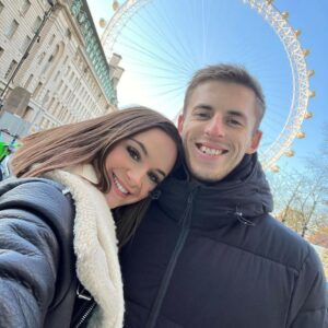 Jake and Georgia posing for a selfie by the London eye